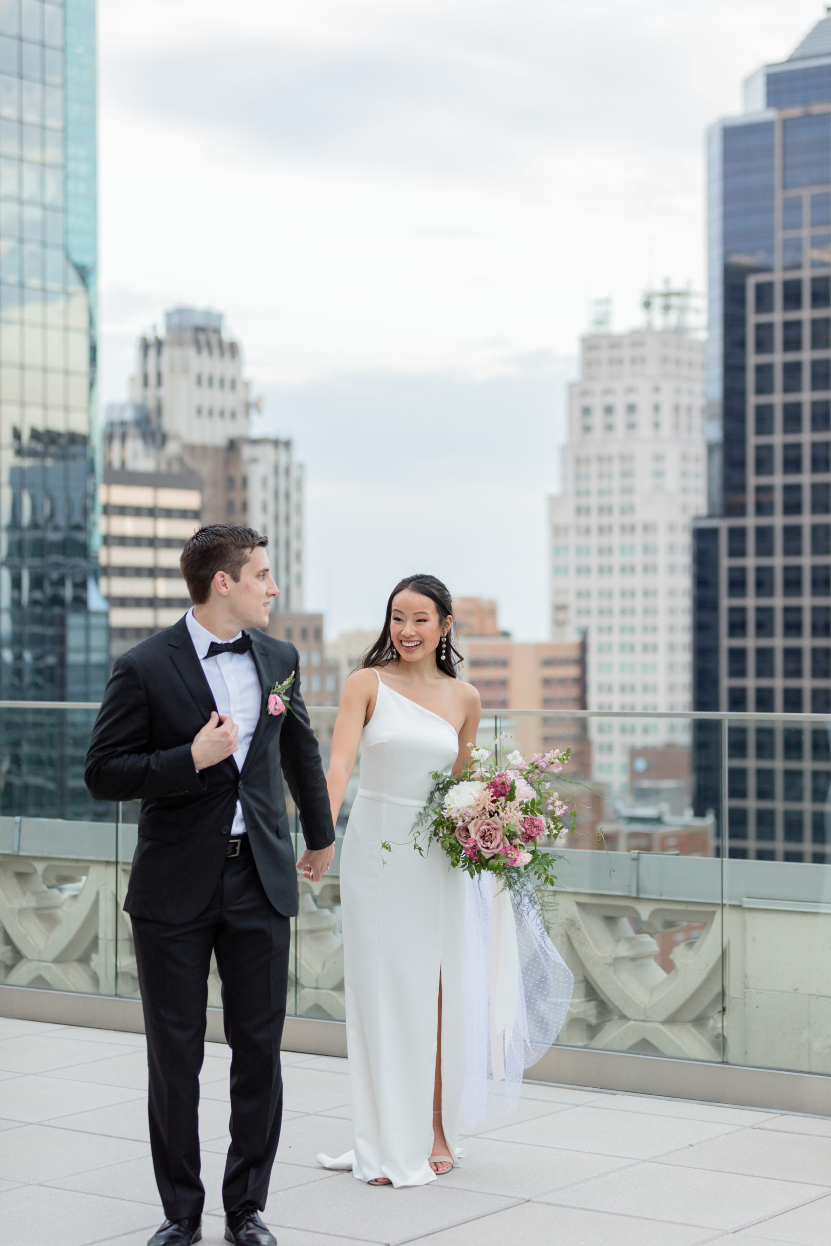 kansas city wedding couple walking on rooftop terrace