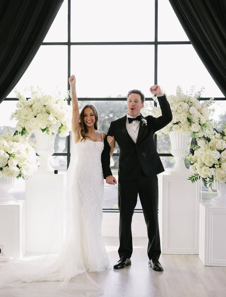Rylie + Mark’s b+w wedding was pure sophistication. Black velvet drapes framed the ceremony in dramatic elegance, while lush white