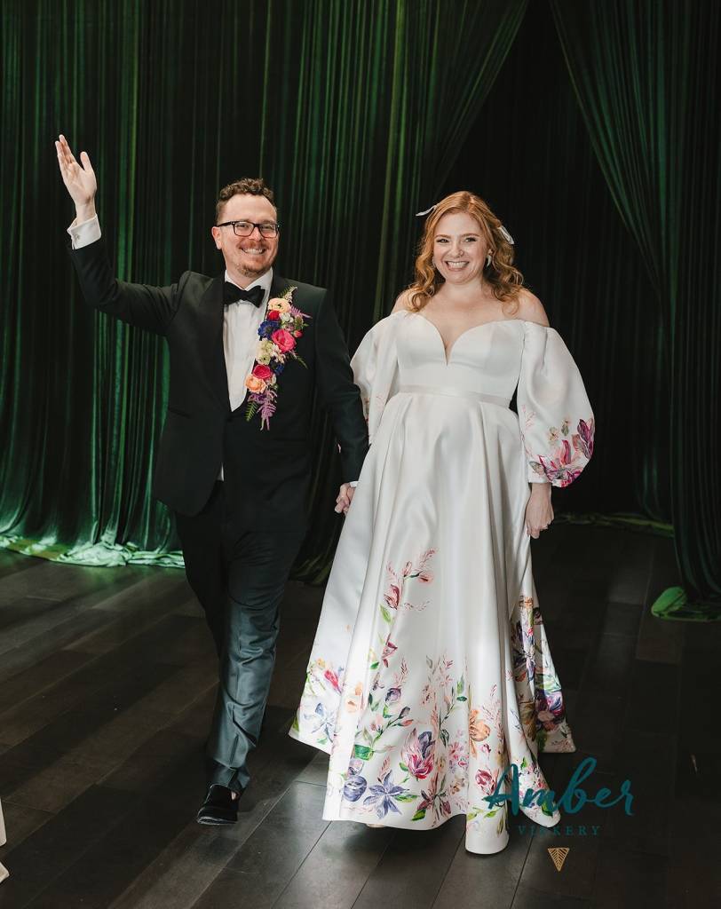 The Waters wedding bloomed in every detail. Chris’s waterfall boutonniere, Kristyn’s floral gown, a stunning garden-inspired ceremony space, and even