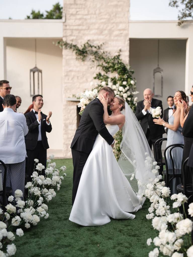 Courtney + Blaise’s celebration was nothing short of beautiful. remiandgold brought their vision to life with white blooms sprouting along
