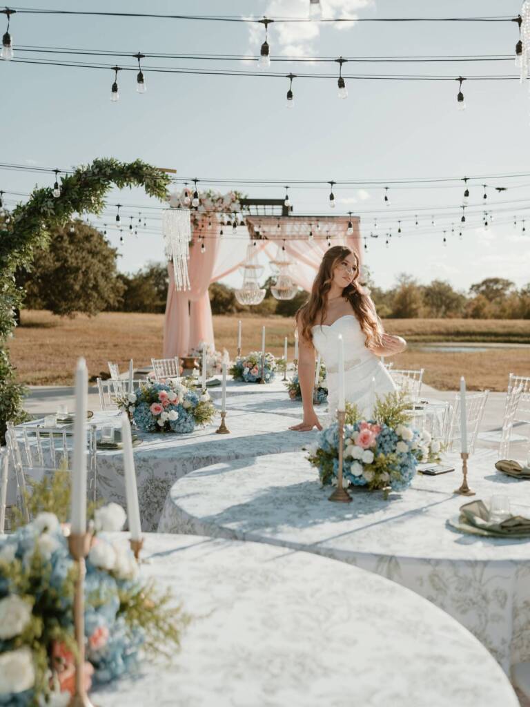 amberdesignconcepts transformed this outdoor ceremony and reception space into an ethereal setting with flowing draping, tapered candles, and elegant hanging