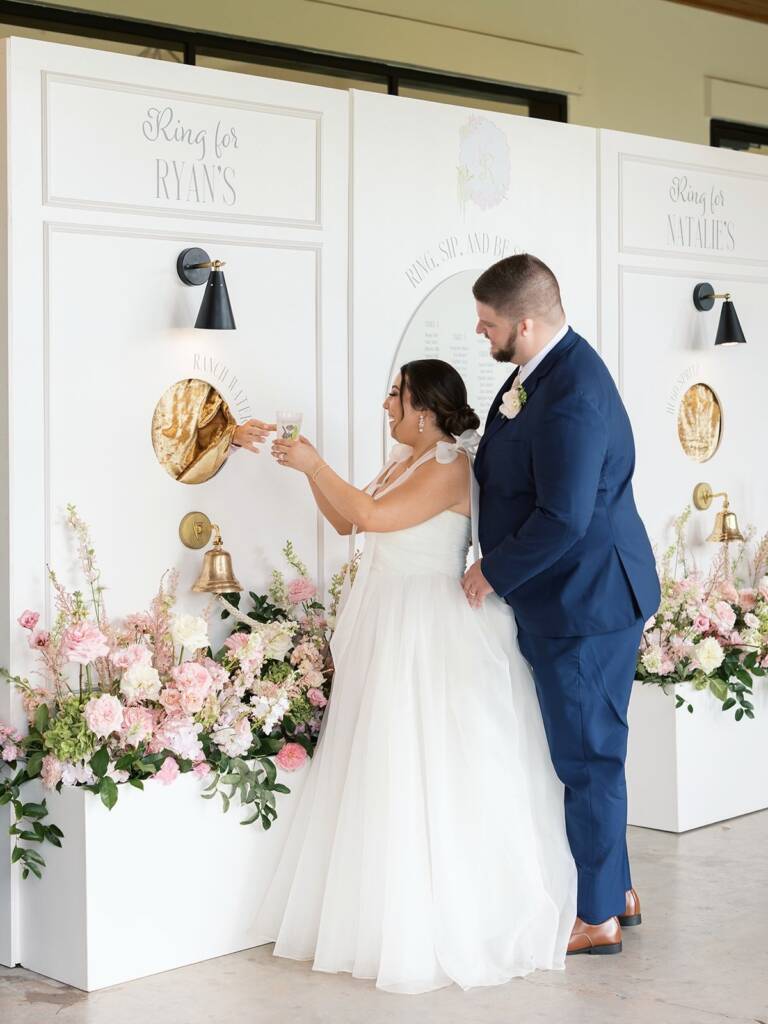 Natalie and Ryan’s wedding was simply unforgettable. From the charming “ring for a drink” display to the custom monograms woven