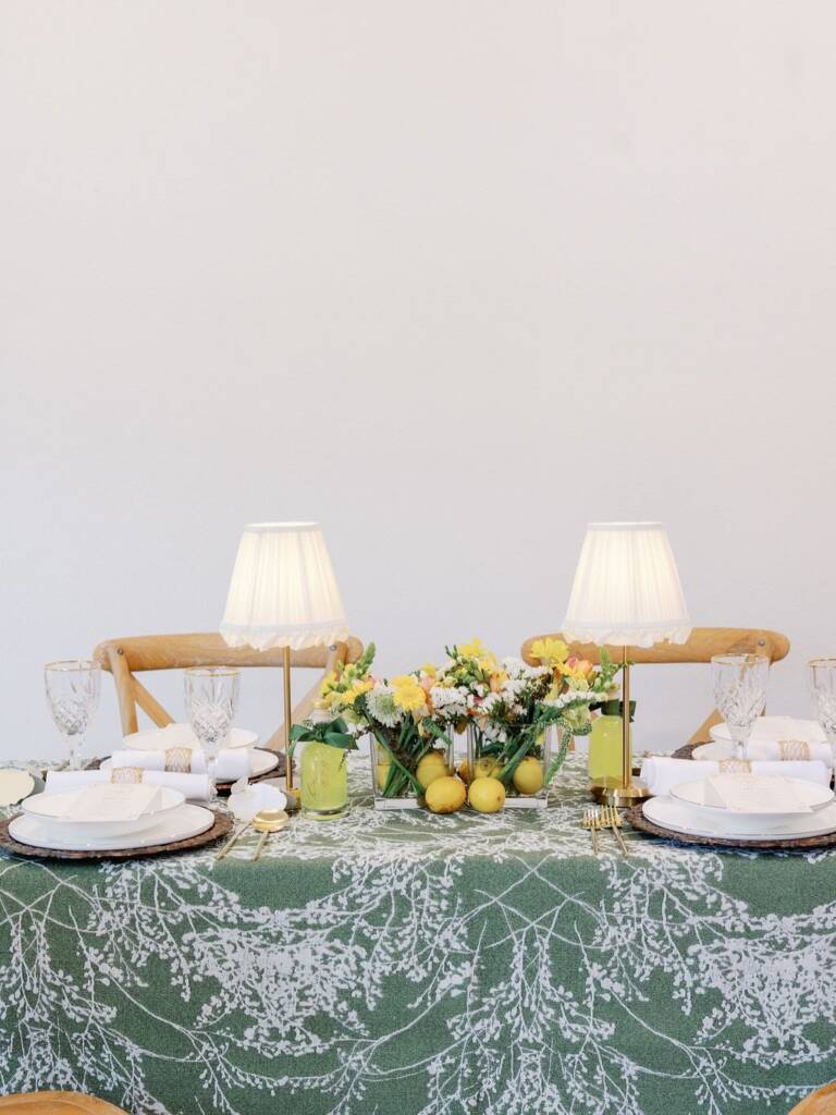 lbwithyouweddings brought an Italian dream to life with gorgeous printed sage linens, cream table lamps, gold accents, and, of course,
